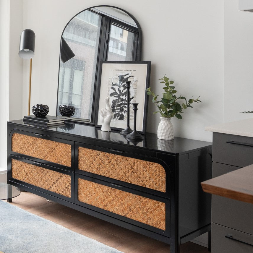 Black laquer and cane sideboard styling with mirror, art and accessories. Side View